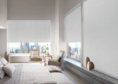 bright roller shades in corner room in high rise