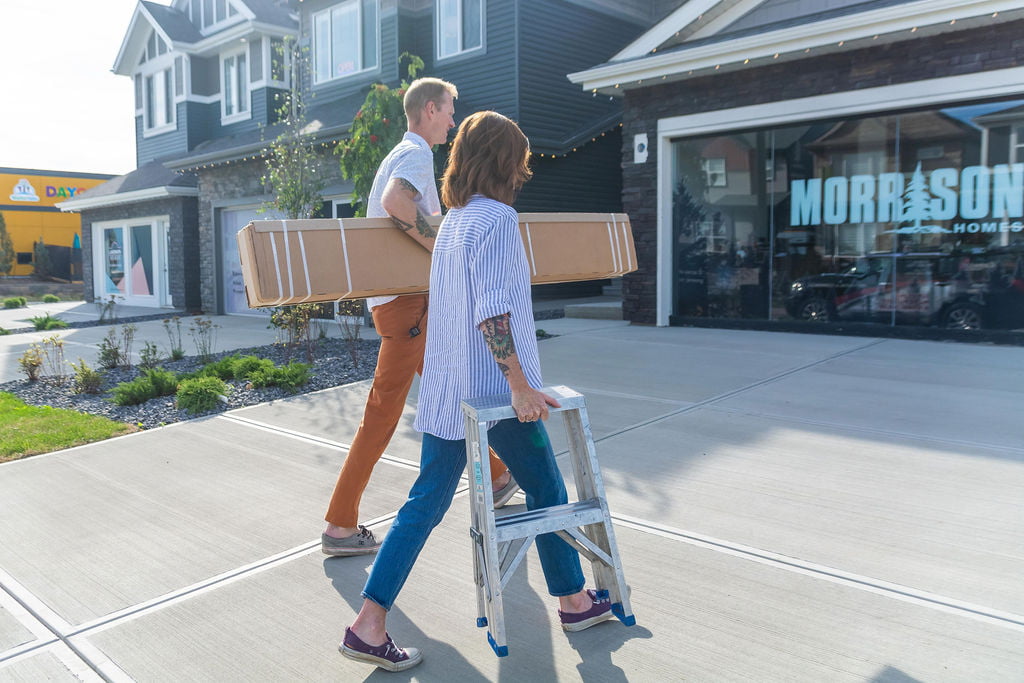 Camelot Interiors owners Chris & Janice Baskin loading window coverings into a job site